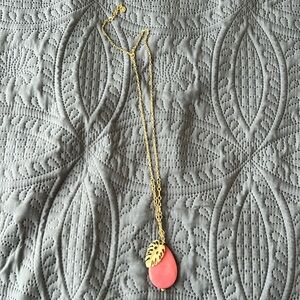 Pink pendant gold colored necklace